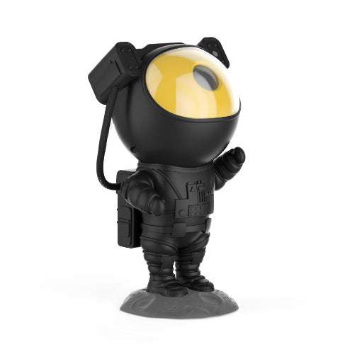 Astronaut-shaped galaxy starry sky projector lamp casting colorful nebula effects on walls.