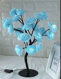 LED Tree Lamp with colorful rose-shaped lights for indoor decoration.