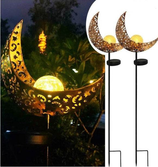LED Solar Flame Light in decorative flame design illuminating garden at night.