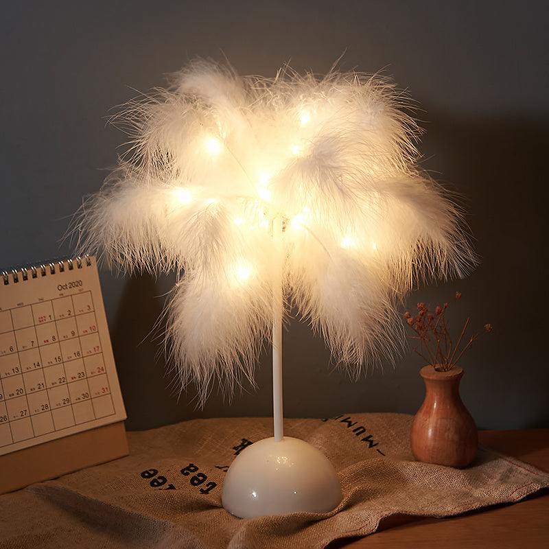 Nordic feather lamp with warm LED lights on a wooden base, perfect for bedroom decoration.