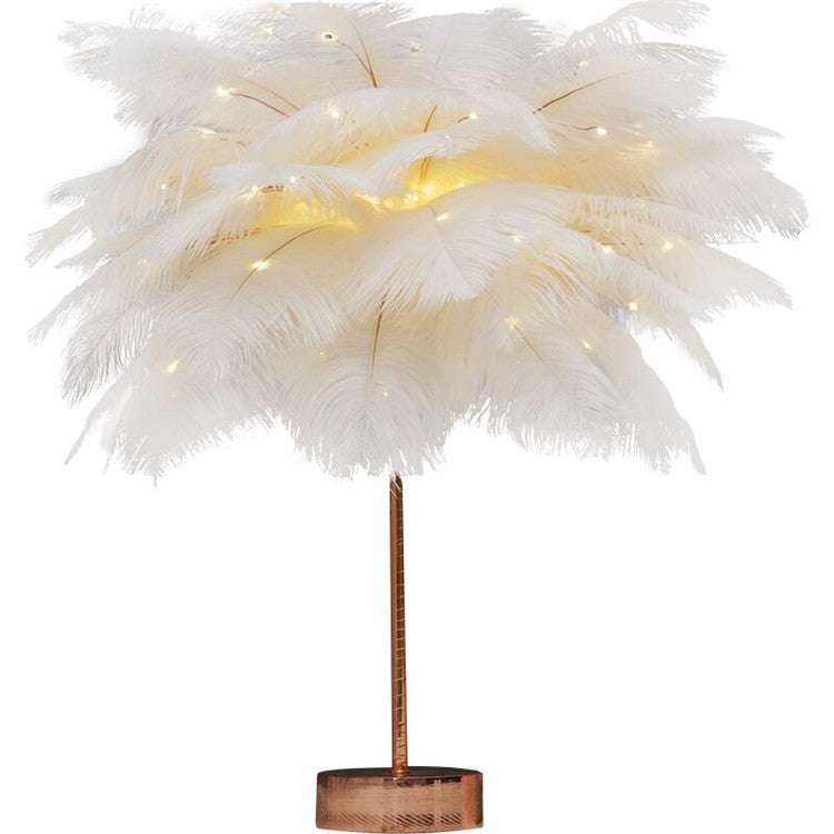 Nordic feather lamp with warm LED lights on a wooden base, perfect for bedroom decoration.