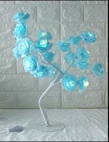 LED Tree Lamp with colorful rose-shaped lights for indoor decoration.