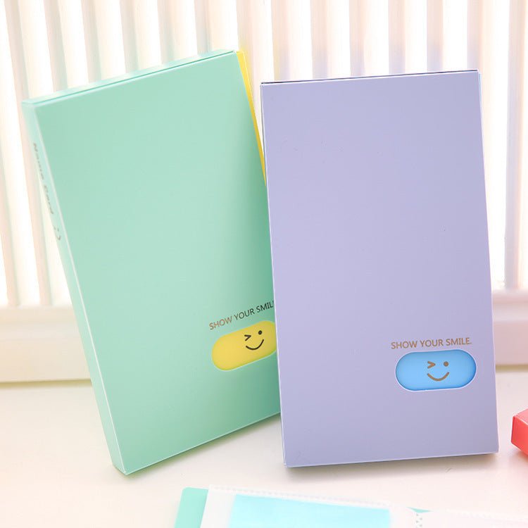 Plastic business card case in pink, open to show cards. Suitable for business gifts.