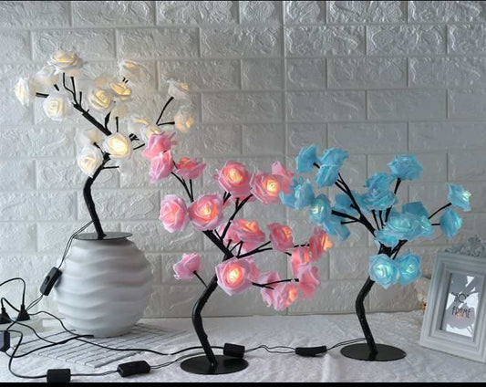 LED Tree Lamp with colorful rose-shaped lights for indoor decoration.