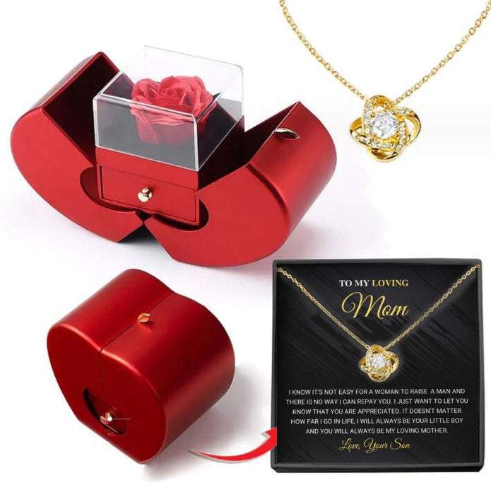 Red apple-shaped fashion jewelry box with eternal rose and necklace, perfect Christmas or Valentine's Day gift.