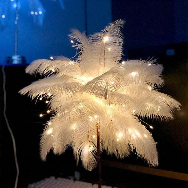 Nordic feather lamp with warm LED lights on a wooden base, perfect for bedroom decoration.