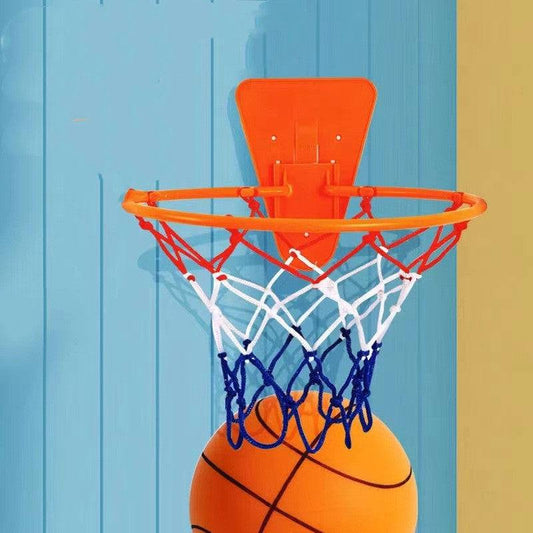 Child playing with Silent Sports Ball indoor basketball set, featuring vibrant bouncy balls in various colors and a hoop.