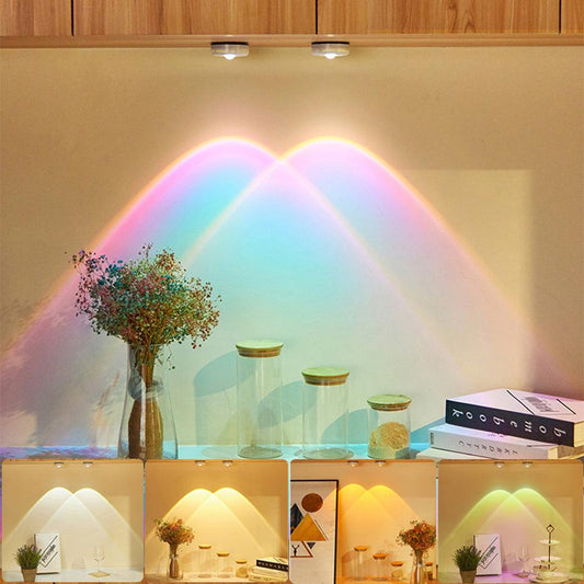 LED lights under cabinet creating colorful sunset effect in a kitchen setting.