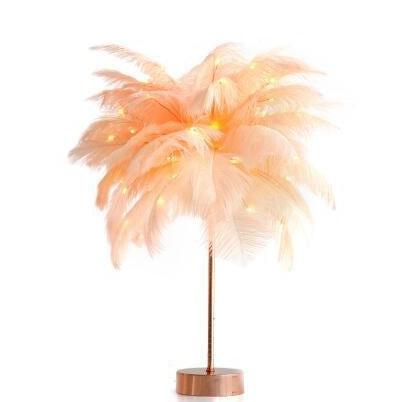Nordic feather lamp with warm LED lights on a wooden base, perfect for bedroom decoration.