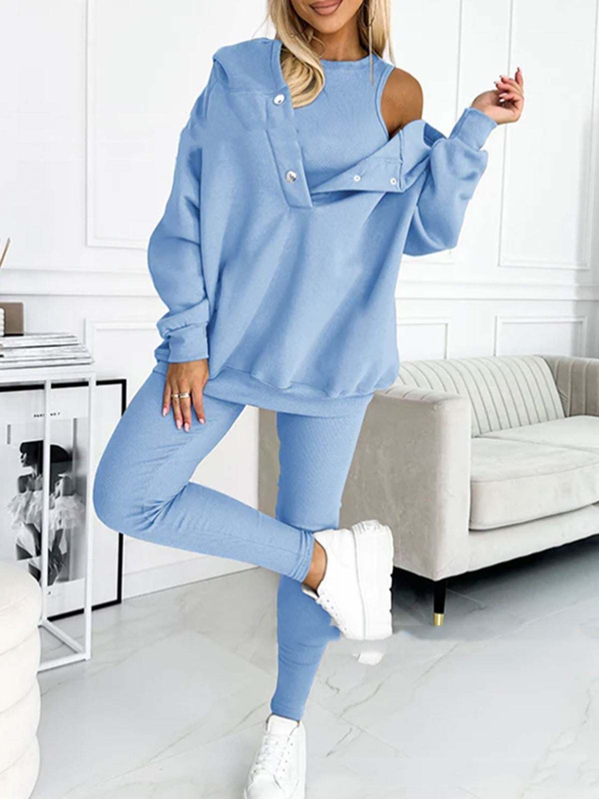 3pcs women's sports suit with hooded sweatshirt, vest, and slim trousers in light blue.