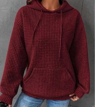 Women's loose casual solid color long-sleeved sweater with hood, available in multiple colors.
