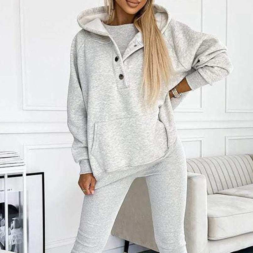 3pcs women's sports suit with hooded sweatshirt, vest, and slim trousers in light blue.