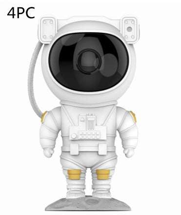 Astronaut-shaped galaxy starry sky projector lamp casting colorful nebula effects on walls.