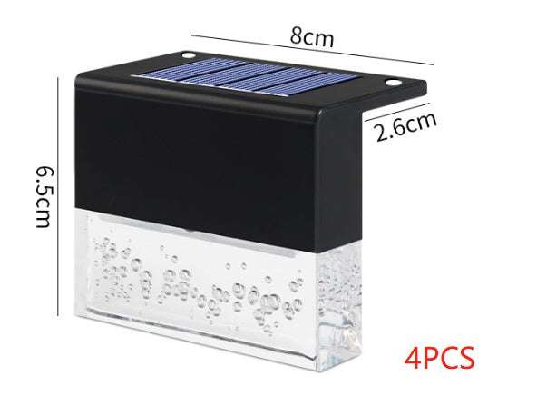 Waterproof New RGB RGB LED solar step lights illuminating a garden fence in multiple colors, waterproof and crystal-like for outdoor decoration.