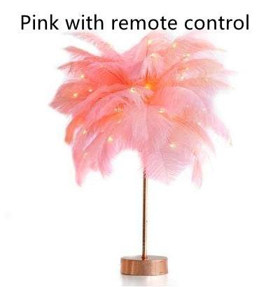 Nordic feather lamp with warm LED lights on a wooden base, perfect for bedroom decoration.