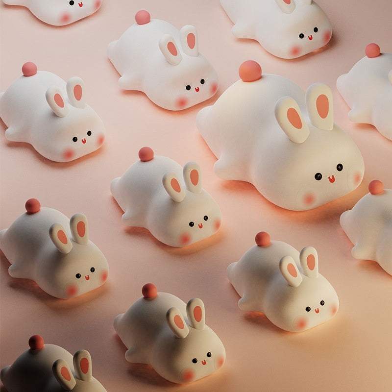 Cute LED night light with touch sensor, rabbit design, adjustable brightness, silicone material, perfect for kids' bedside.