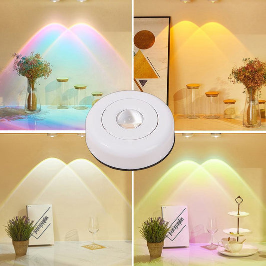 LED lights under cabinet creating colorful sunset effect in a kitchen setting.