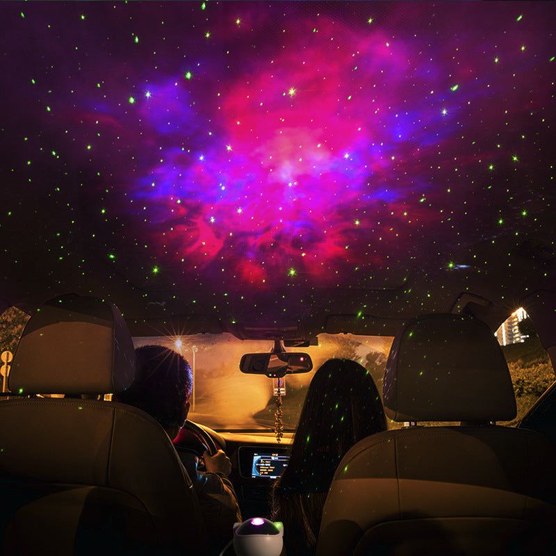 Astronaut-shaped galaxy starry sky projector lamp casting colorful nebula effects on walls.