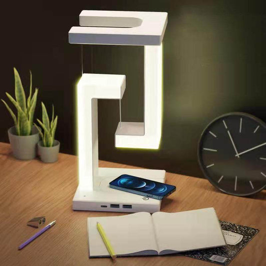 Creative smartphone wireless charging balance lamp with magnetic suspension, featuring modern design and eye protection technology.