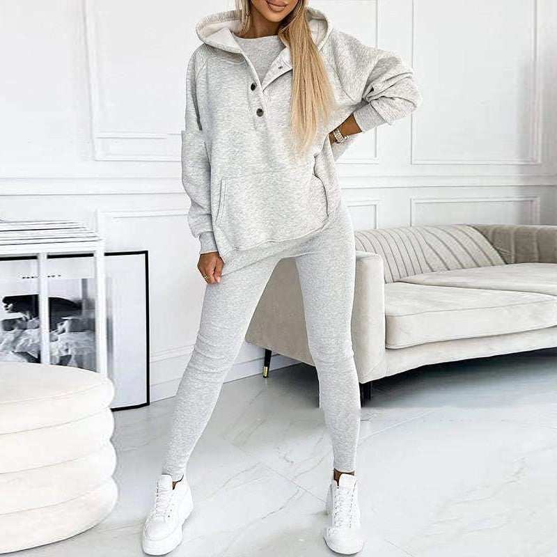 3pcs women's sports suit with hooded sweatshirt, vest, and slim trousers in light blue.